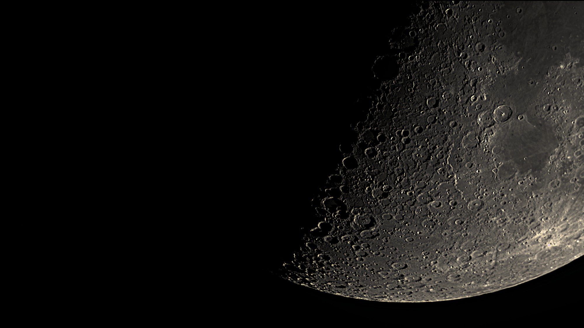 The Moon near first quarter: the southern limb and terminator, cratered highlands in sharp relief, processed in Akastroid